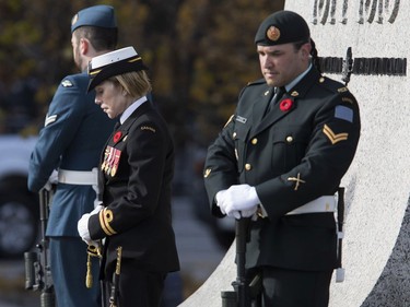 Three members of the Canadian Armed Forces stand on sentry duty at the National War Memorial during Remembrance Day services on Thursday, Nov. 11, 2021