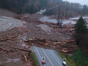 Highway crews assess the damage at a washout of Highway 7, one of two highways connecting the Lower Mainland with Hope, B.C. and communities beyond. A cascade of catastrophic washouts have sealed off all road, rail and pipeline access between Coastal B.C. and the rest of Canada.