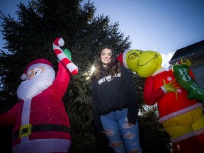 Ava James-Sidoli, 15, youth ambassador for the Ottawa Food Bank, has set up Christmas decorations in her front yard in Carp for people to take photographs while donating non-perishable food items or cash until Dec. 20.