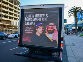 Mobile billboards urging Justin Bieber to cancel his upcoming concert in Saudi Arabia near the Microsoft Theater on November 21, 2021 in Los Angeles, California.