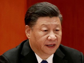 FILE PHOTO: Chinese President Xi Jinping speaks at a meeting commemorating the 110th anniversary of Xinhai Revolution at the Great Hall of the People in Beijing, China October 9, 2021. REUTERS/Carlos Garcia Rawlins/File Photo