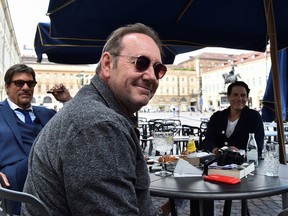 Actor Kevin Spacey sits at a caffe in Piazza San Carlo as he visits the city, where he is expected to return for a cameo appearance in a low budget Italian film, after largely disappearing from public view, in Turin, Italy, June 1, 2021.