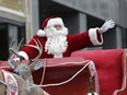 Santa waves during a previous edition of the Help Santa Toy Parade as it made its way through downtown Ottawa.