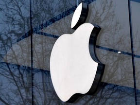 (FILES) In this file photo taken on February 8, 2018 the logo of the US multinational technology company Apple is on display.