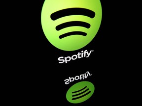 (FILES) This file illustration taken on April 19, 2018 shows the logo of online streaming music service Spotify displayed on a tablet screen.