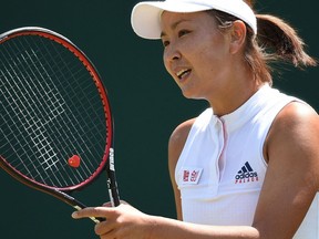 (FILES) In this file photo taken on July 3, 2018, China's Peng Shuai reacts against Australia's Samantha Stosur during their women's singles first round match on the second day of the 2018 Wimbledon Championships at The All England Lawn Tennis Club in Wimbledon, southwest London. - Britain on November 20, 2021 urged China to provide "verifiable evidence" about the "safety and whereabouts" of tennis star Peng Shuai, whose whereabouts are unclear after making sexual assault allegations against a top Communist Party official.