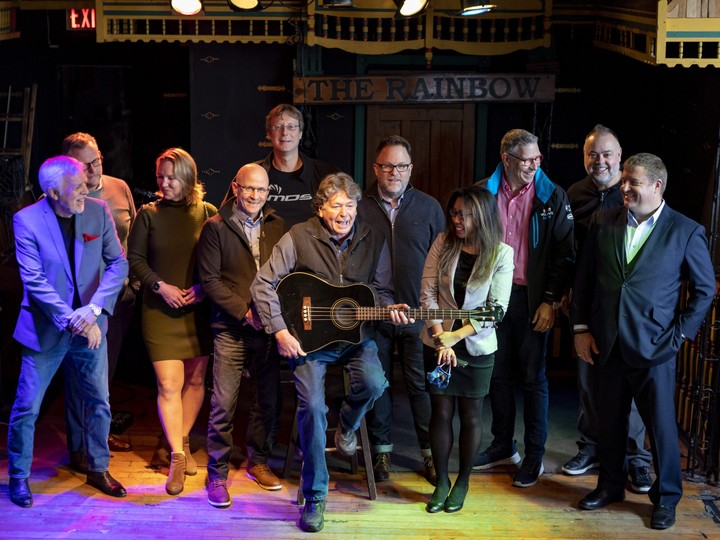  Rainbow Bistro owner Danny Sivyer (seated) is surrounded by members of the group of music-loving business leaders called the Rainbow Bistro Business Amplifiers who have raised $50,000, so far, to support the business.