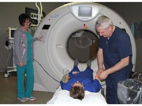 Medical radiation technologists at an Ontario hospital are seen here, pre-COVID, operating a computerized tomography (CT) scanner. MRTs have struggled with the challenges of the pandemic in the health sector but have not had the same support as physicians and nurses.