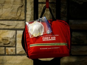 An N95 face mask attached to a first aid kit is seen near the House of Commons, in this file photo.