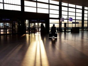 FILE PHOTO: A passenger arrives to a terminal at Ben Gurion international airport.