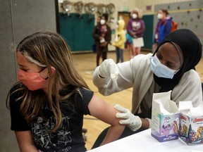 Vaccines for children aged five to 11 are expected to be approved on Friday. In the U.S., many kids such as Ione Thompson, 10, have received at least their first dose.