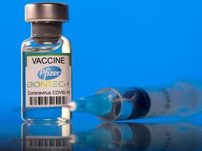 Files: A vial labelled with the Pfizer-BioNTech coronavirus disease (COVID-19) vaccine is seen in this illustration picture taken March 19, 2021.