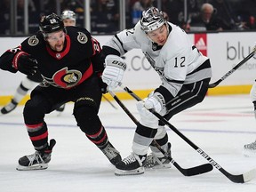 Los Angeles Kings centre Trevor Moore (12) plays for the puck against Ottawa Senators right wing Connor Brown (28) during the first period at Staples Center.