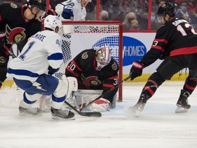 Ottawa Senators goalie Matt Murray (30) makes a save in front of Tampa Bay Lightning left wing Pierre-Edouard Bellemare (41) in the first period at the Canadian Tire Centre.