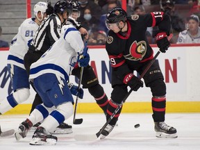 Ottawa Senators right wing Drake Batherson (19) loses sight of the puck in the second period against the Tampa Bay Lightning  at the Canadian Tire Centre.
