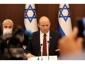 Israeli Prime Minister Naftali Bennett and Foreign Minister Yair Lapid attend a weekly cabinet meeting in Jerusalem on Nov. 7.