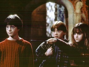 (left to right) Daniel Radcliffe, Rupert Grint and Emma Watson in a scene from "Harry Potter and the Philosopher's Stone."