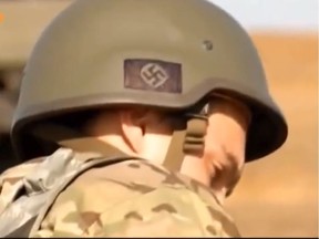 File photo: A news broadcast by German ZDF station showed soldiers of the Ukraine Azov Battalion with nazi symbols on their helmets.