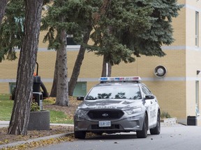 A police car is parked outside St. Michael's College School in Toronto on Thursday, November 15, 2018.