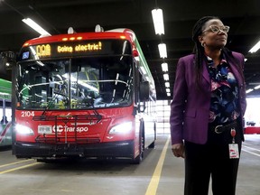 Renée Amilcar, Ottawa's new general manager of transit services, stands near one of the city's new electric buses.