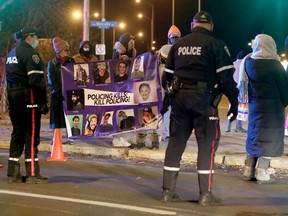 Community organizations, residents blockade highway in opposition to proposed increase to the Ottawa police budget.