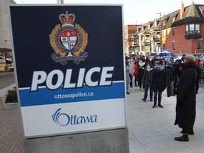 Community organizations, residents protest in downtown Ottawa in opposition to a proposed increase to the Ottawa Police budget for 2022.