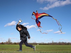 Files: With some gusting winds, it might be a good day to fly a kite — if you're dressed for it.