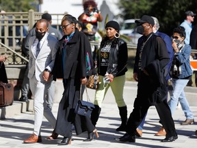 Wanda Cooper-Jones, mother of Ahmaud Arbery, walks outside the Glynn County Courthouse after the jury reached a verdict in the trial of William "Roddie" Bryan, Travis McMichael and Gregory McMichael, charged with the February 2020 death of 25-year-old Ahmaud Arbery, in Brunswick, Georgia, U.S., November 24, 2021.