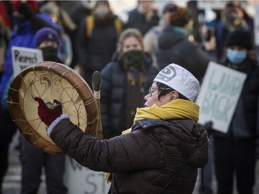 Elder Marlene Hale leads a rally Sunday on Wellington Street in support of the Wet'suwet'en people and their opposition to the Coastal GasLink pipeline, as well as the RCMP's arrest of land defenders in British Columbia last week.