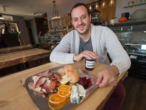 File: Meat Press Creative Charcuterie and Sandwich Shop, owner Etienne Cuerrier, says the shop is taking an extended hiatus