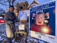 Shawn Turcotte poses with the CHEO Bear in front of the family's house, which has been decorated with a Home
Alone theme with a goal of raising $100k for CHEO mental health services.