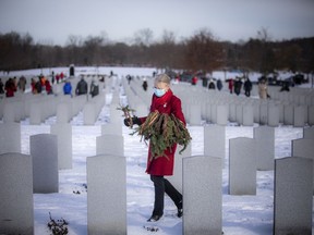 Christina Walker came to lay a wreath on her husband's grave as well those of other fallen military members Sunday. Her husband passed away in 2010. Walker has been coming to this ceremony for years and appreciates being able to take a moment and read each name before placing the wreath.
