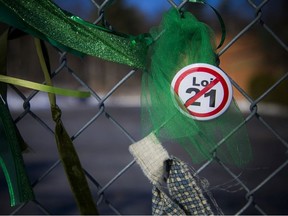 A group gathered in solidarity with teacher Fatemeh Anvari on Sunday, tying green ribbons onto the fence of Chelsea Elementary School to protest Quebec's Bill 21.