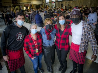 Also at Saturday morning's event were, left to right, Redblacks all-star punter Richie Leone; Nancy Crump, donor communications senior manager with Ottawa Sports and Entertainment Group; Catherine McLaughlin of Terlin Construction and a volunteer with the event; Janice Barresi, executive director of the OSEG Foundation; and Dan Basambombo, a Redblacks linebacker.