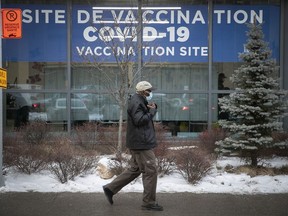 A man makes his way toward a COVID-19 vaccination clinic