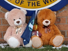 Stuffed bears sit at a makeshift memorial outside of Oxford High School on December 01, 2021 in Oxford, Michigan. Yesterday, four students were killed and seven injured when a gunman opened fire on students at the school.