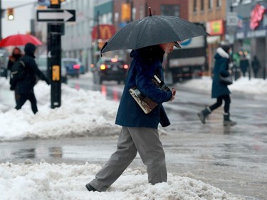 Snow turned to rain by late morning making for slippery walking and driving conditions along Elgin Street and elsewhere in the city.