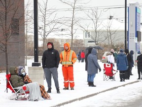 Long lineup for free COVID-19 rapid tests at the Barrhaven Minto Centre Dec. 22, 2021.