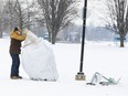 City of Ottawa crews on Tuesday removed sign posts and laid bales of hay to act as barriers to other obstacles at the Mooney's Bay hill where an 11-year-old girl died in a sledding accident a day before.