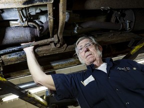 Kenny Wagorn, of Leo Wagorn & Sons Inc., shows the location of a catalytic converter on a Dodge pickup. Ottawa police have recorded 357 thefts of the precious-metal laden devices between Jan. 1 and Dec. 16, 2021.