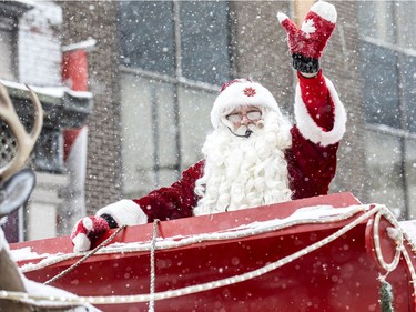 Nothing can stop Santa and the firefighters, as the Help Santa Toy Parade went from City Hall, down Laurier Ave till Bank Street where it wrapped up through the Glebe near Lansdowne.