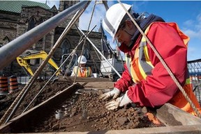 Archeologists search soil excavated during their investigation of Parliament Hill. Photo: PWGSC