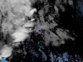 This National Oceanic and Atmospheric Administration (NOAA) satellite image shows a winter storm threatening the Hawaiian archipelago on December 7, 2021.