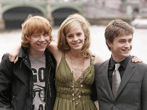 Actors Rupert Grint, (L) Emma Watson (C) and Daniel Radcliffe, (R) the cast of the forthcoming Harry Potter film 'Harry Potter and the Order of the Phoenix', pose for photographs in central London 25 June 2007.
