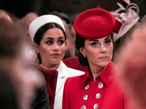 A report from a British television presenter with ties to the Royal Family says Kate, The Duchess of Cambridge, in front, criticized her future sister-in-law, Meghan, Duchess of Sussex, rear, over the latter’s treatment of royal staff, something the Duchess of Sussex has denied.