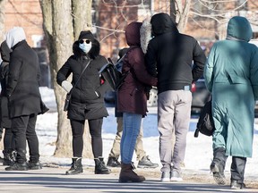 File: People wait in line to receive a COVID-19 test in Montreal