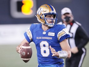 Winnipeg Blue Bombers quarterback Zach Collaros (8) looks to throw the ball downfield during the 2nd quarter against the Montreal Alouettes during a Canadian football League game at IG Field, Nov. 6, 2021.