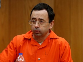FILE PHOTO: Larry Nassar, a former team USA Gymnastics doctor who pleaded guilty in November 2017 to sexual assault charges, sits in the courtroom during his sentencing hearing in the Eaton County Court in Charlotte, Michigan, U.S., February 2, 2018.