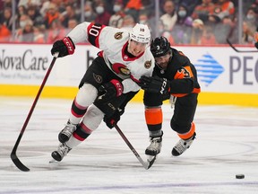 Ottawa Senators left wing Alex Formenton (10) battles for the puck against Philadelphia Flyers defenceman Keith Yandle (3) in the second period at the Wells Fargo Center.