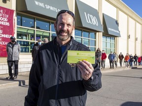 Pete McIntosh was happy to pick up a COVID-19 antigen rapid test kit at the LCBO on Wonderland Road at Southdale Road in London, Ont. on Friday December 17, 2021.
